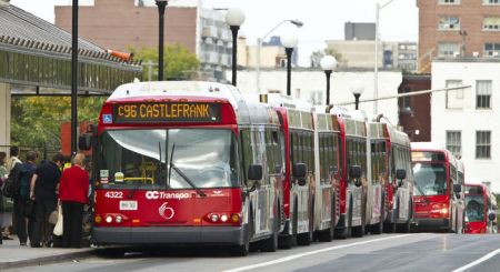 Ottawa's "BRT" Transitway delivers a "conga line" of buses onto urban streets. Photo: Errol McGhion.