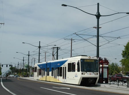 Portland's light rail transit line on 4-lane Interstate Avenue gives an idea of how urban rail could operate in reservation in G-L corridor. (Photo: Peter Ehrlich)