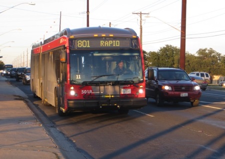 MetroRapid bus, southbound on N. Lamar, nears Koenig Lane during testing on Dec. 10th. By dumping urban rail for this corridor, Project Connect would be free to proceed with plan to install specially paved bus lanes instead of rails. Photo: L. Henry.