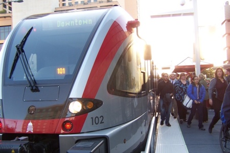 Commuting passengers deboard a MetroRail train. During SXSW, passengers have jammed onto trains, setting new ridership records. Photo: L. Henry.