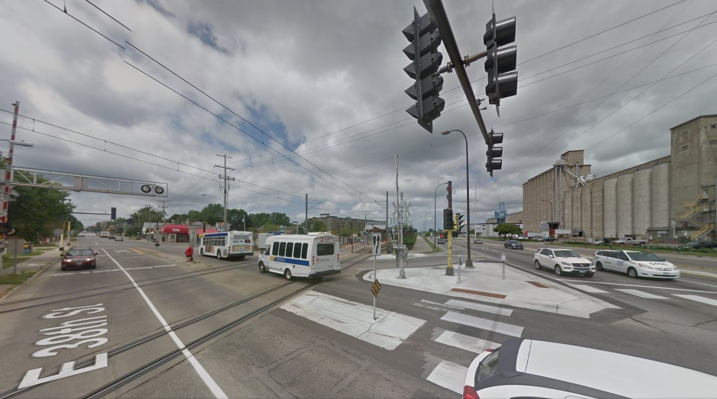 From a surface view, this shows the intersection protected with crossing gates. Photo: ARN, from Google Street View.