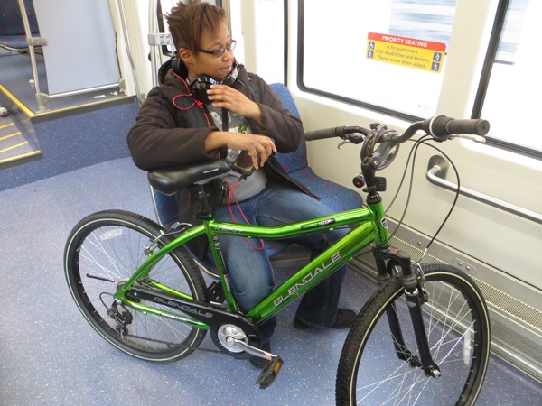 In some cases, smaller bikes are simply held by the passenger. Photo: L. Henry.
