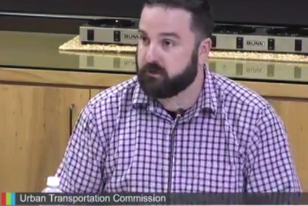 J.D. Gins, member of Urban Transportation Commission, at May 10th meeting, argues for recommendation to Austin City Council to include rail transit in November bond package. ARN screenshot from COA video.